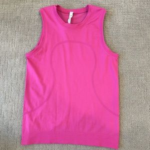 Lululemon swiftly tech muscle tank top in the color sonic pink.